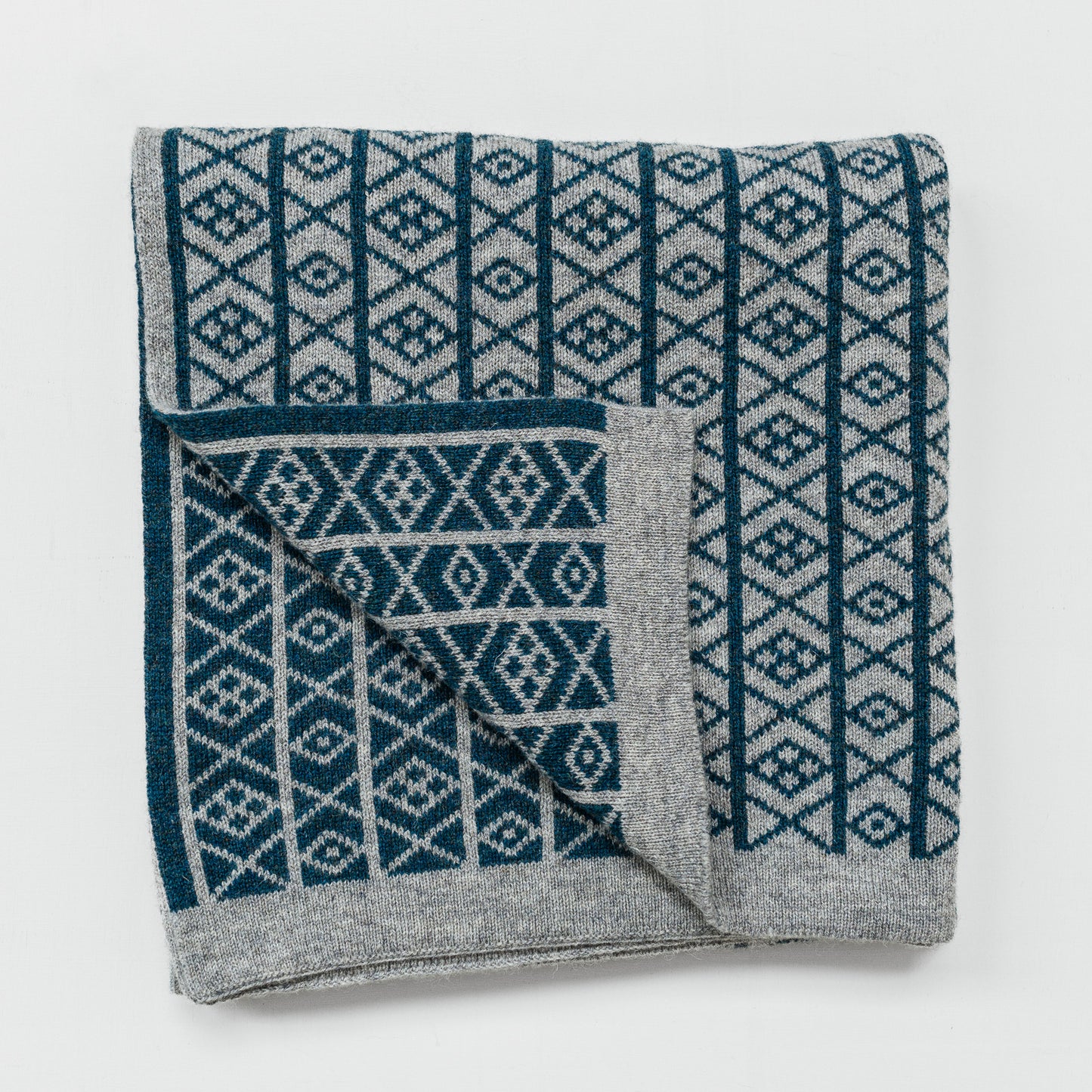 The Ruskin British Wool Jacquard Blanket in Kingfisher Blue / Grey