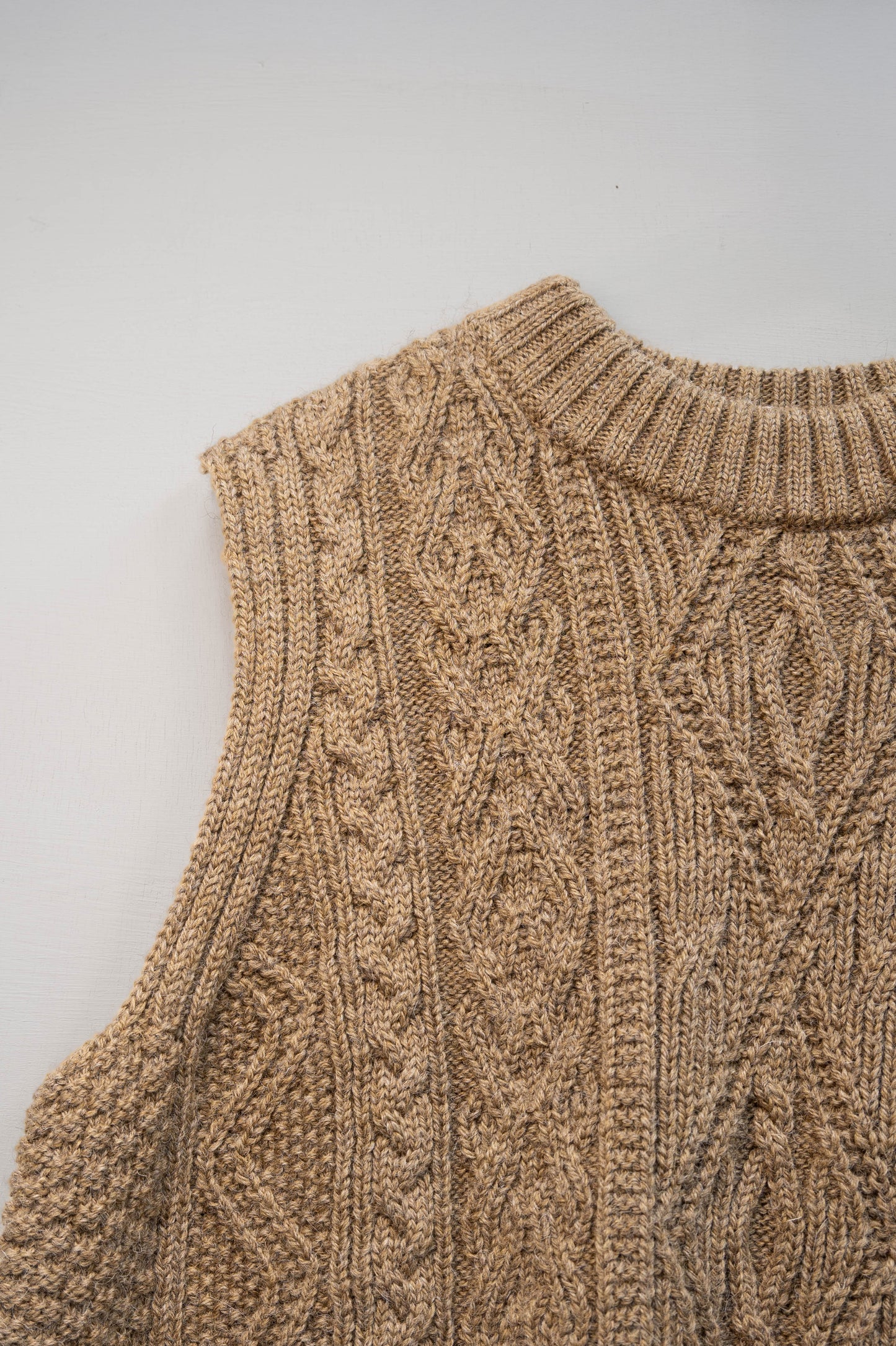 The Freyja British Wool Cable Vest in Bronze Olive