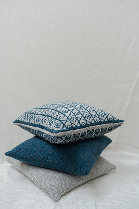 The Ruskin British Wool Jacquard Cushion in Kingfisher Blue/ Grey